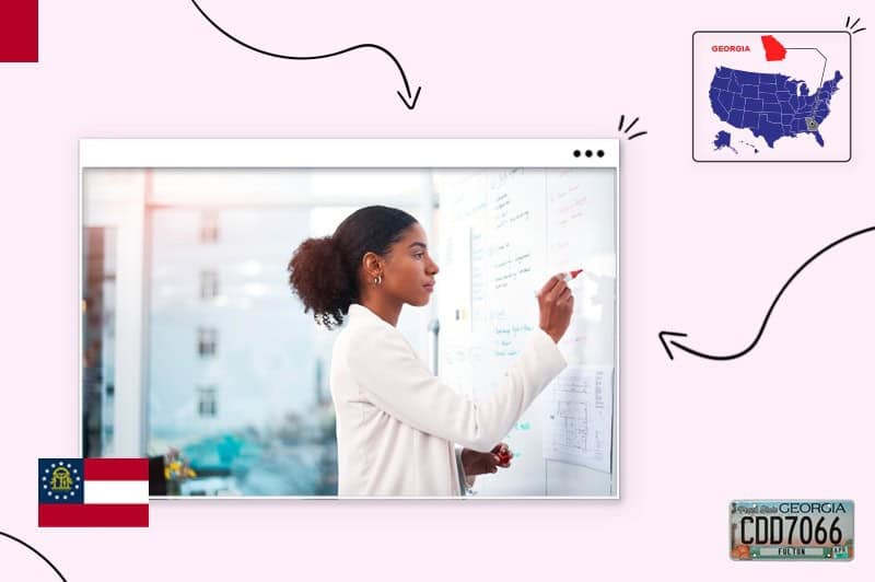 Small business owner writing on a white board 