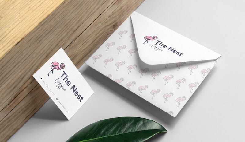 The Nest branded envelope and business card