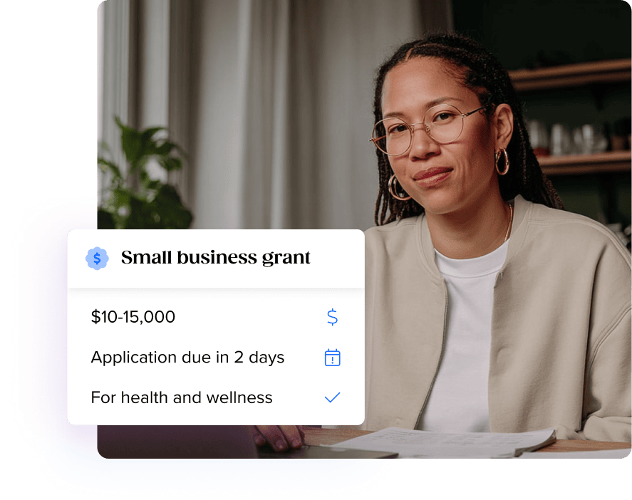 Business woman performing a funding search for grants