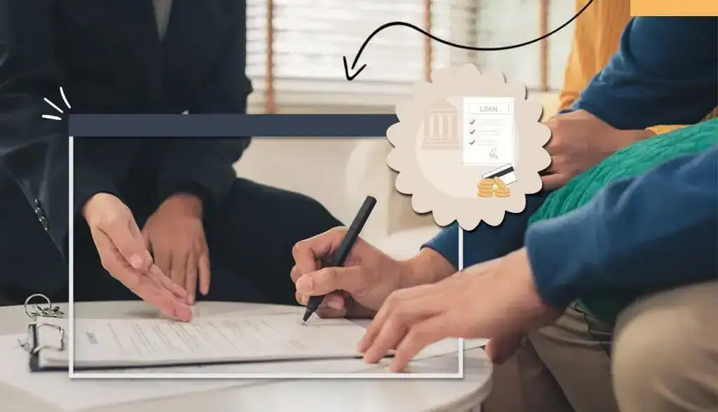 A person signing a document on a desk
