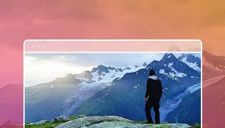 Hiker standing in front of mountains