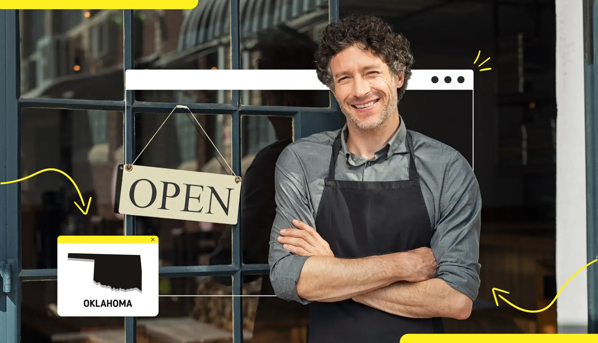A business owner standing outside a store with an "open" sign Oklahoma state map